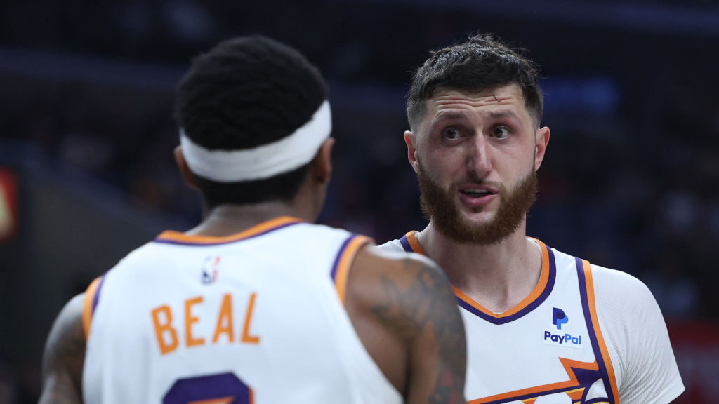 LOS ANGELES, CALIFORNIA - APRIL 10: Jusuf Nurkic #20 of the Phoenix Suns talks with Bradley Beal #3...