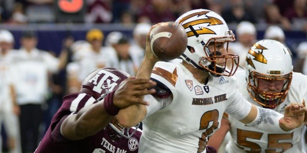 Arizona State quarterback Mike Bercovici (2) is pressured as he passes by Texas A&M defensive l...