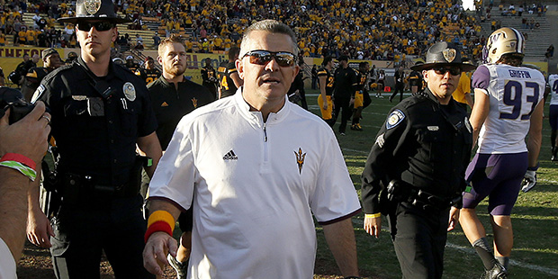 Arizona State head coach Todd Graham runs on the field after a win to shake hands with the Washingt...