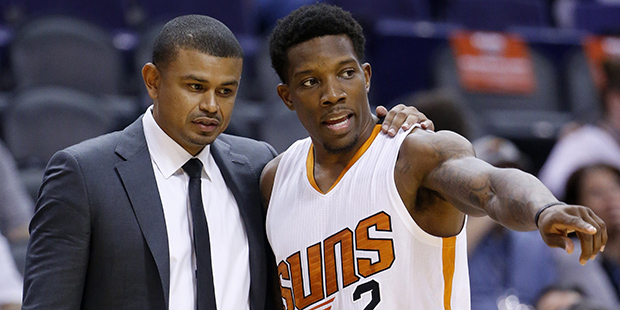 Phoenix Suns' Eric Bledsoe (2) talks with head coach Earl Watson during the first half of an NBA pr...