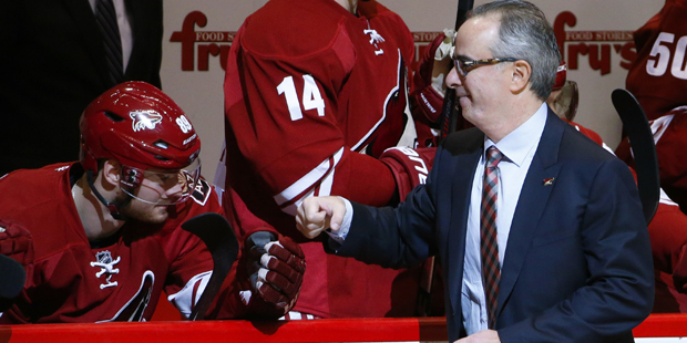 New Arizona Coyotes majority owner Andrew Barroway, right, fist pumps team members, including Mikke...