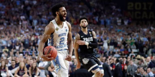North Carolina's Joel Berry II (2) celebrates after the finals of the Final Four NCAA college baske...