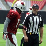 Receiver Jaron Brown chats with a referee during Arizona Cardinals training camp Aug. 7. (Photo by Adam Green/Arizona Sports)
