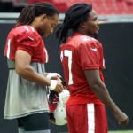 Receiver Larry Fitzgerald and running back Chris Johnson watch during training camp Aug. 20. (Photo: Adam Green/Arizona Sports)