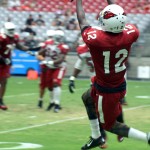 Receiver John Brown leaps to make a catch during Arizona Cardinals training camp Aug.12. (Photo by Adam Green/Arizona Sports)