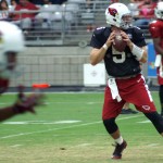 Drew Stanton drops back to pass while Larry Fitzgerald begins his route  during training camp Aug. 13. (Photo by: Adam Green/Arizona Sports)