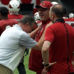 Ron Wolfley and Dave Pasch chat with Cardinals coach Bruce Arians during training camp Aug. 20. (Photo: Adam Green/Arizona Sports)