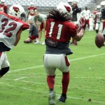 Receiver Larry Fitzgerald is unable to come with the ball on a pass that was defended well by Tyrann Mathieu during training camp Aug. 3. (Photo by Adam Green/Arizona Sports)