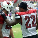 Safety Tony Jefferson talks to cornerback Justin Bethel during Arizona Cardinals training camp Aug.12. (Photo by Adam Green/Arizona Sports)