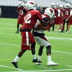 Safety Tyrann Mathieu steps in front of receiver John Brown to intercept a pass during training camp Aug. 1, 2015 (Photo by Adam Green/Arizona Sports)