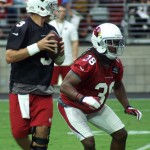Running back Andre Elilngton steps up to block for QB Carson Palmer during training camp Aug. 1, 2015 (Photo by Adam Green/Arizona Sports)
