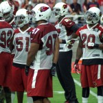 Members of the Arizona Cardinals defense wait for the play during training camp Aug. 1, 2015 (Photo by Adam Green/Arizona Sports)