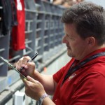 Cardinals owner Michael Bidwill signs autographs during training camp Aug. 1, 2015 (Photo by Adam Green/Arizona Sports)