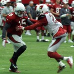 Receiver Michael Floyd tries to get past the coverage of CB Patrick Peterson during training camp Aug. 3. (Photo by Adam Green/Arizona Sports)