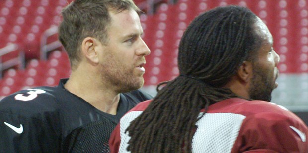 QB Carson Palmer and WR Larry Fitzgerald watch at Arizona Cardinals training camp Thursday, August ...