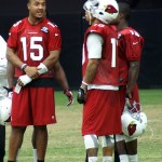 Injured receiver Michael Floyd chats with some teammates during training camp Aug. 20. (Photo: Adam Green/Arizona Sports)