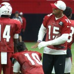 Injured receiver Michael Floyd talks with Brittan Golden and J.J. Nelson during Arizona Cardinals training camp Aug. 11. (Photo by Adam Green/Arizona Sports)