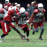 Receivers John Brown and Larry Fitzgerald begin their routes during training camp Aug. 24. (Photo: Adam Green/Arizona Sports)