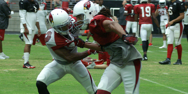 Justin Bethel battled Larry Fitzgerald down the field during Arizona Cardinals training camp. (Phot...