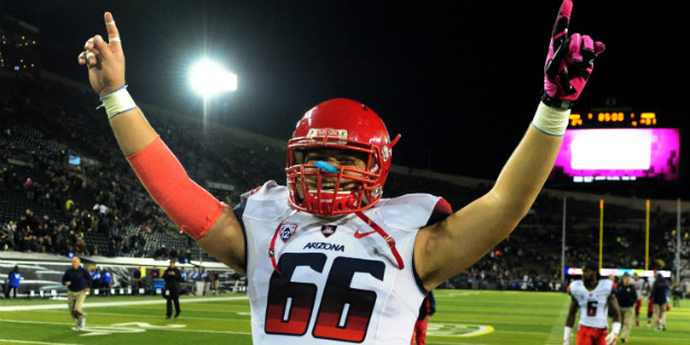 Arizona offensive linesman Carter Wood (66) celebrates after the NCAA college football game against...