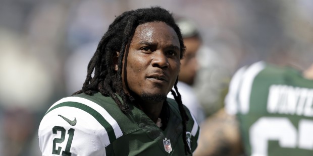 FILE - In this Sept. 28, 2014, file photo, New York Jets running back Chris Johnson warms up before...