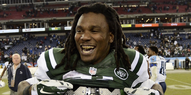 New York Jets running back Chris Johnson trades jerseys with Tennessee Titans players, after an NFL...