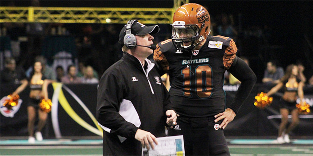 Arizona Rattlers head coach Kevin Guy talks with quarterback Nick Davila. The Rattlers open the 201...