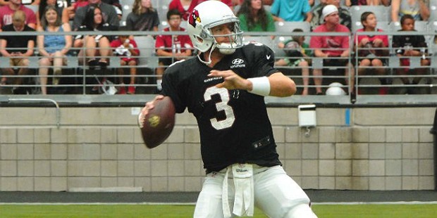 Quarterback Carson Palmer delivers a pass at Arizona Cardinals Training Camp in Glendale Monday, Au...