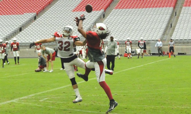 Tyrann Mathieu breaks up a pass intended for Larry Fitzgerald. (Photo by Vince Marotta/Arizona Spor...