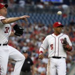 Washington Nationals starting pitcher Max Scherzer (31) throws to first base but Arizona Diamondbacks' Ender Inciarte (5) was safe at first after his bunt during the first inning of a baseball game at Nationals Park, Tuesday, Aug. 4, 2015, in Washington. (AP Photo/Alex Brandon)