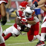 Arizona Cardinals wide receiver J.J. Nelson (14) is tackled by Kansas City Chiefs cornerback Jamell Fleming during the first half of an NFL preseason football game, Saturday, Aug. 15, 2015, in Glendale, Ariz. (AP Photo/Ross D. Franklin)