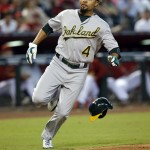 Oakland Athletics' Coco Crisp scores on a hit by Mark Canha in the seventh inning during a baseball game against the Arizona Diamondbacks, Sunday, Aug. 30, 2015, in Phoenix. (AP Photo/Rick Scuteri)