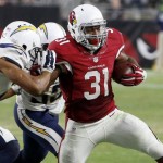 Arizona Cardinals' David Johnson (31) gets tackled by San Diego Chargers' Lowell Rose, left, and Kavell Conner during the first half of an NFL preseason football game Saturday, Aug. 22, 2015, in Glendale, Ariz. (AP Photo/Ross D. Franklin)