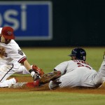 St. Louis Cardinals' Jason Heyward, right, steals second base in front of Arizona Diamondbacks second baseman Chris Owings in the first inning during a baseball game, Tuesday, Aug. 25, 2015, in Phoenix. (AP Photo/Rick Scuteri)