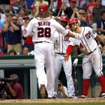 Washington Nationals' Bryce Harper (34) congratulates teammate Jayson Werth (28) at home base as the two score in the fifth inning of a baseball game against the Arizona Diamondbacks in Washington, Thursday, Aug. 6, 2015. Nationals' Michael Taylor (3) looks on. (AP Photo/Jacquelyn Martin)