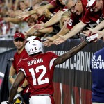 Arizona Cardinals wide receiver John Brown (12) celebrates his touchdown against the San Diego Chargers with fans during the first half of an NFL preseason football game, Saturday, Aug. 22, 2015, in Glendale, Ariz. (AP Photo/Ross D. Franklin)