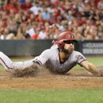 Arizona Diamondbacks' Ender Inciarte slides into home to score on a single by A.J. Pollock during the fifth inning of a baseball game against the Cincinnati Reds, Thursday, Aug. 20, 2015, in Cincinnati. (AP Photo/Gary Landers)