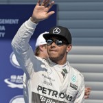 Mercedes driver Lewis Hamilton of Britain waves to supporters after winning the qualifying session at the Spa-Francorchamps circuit, Belgium, Saturday, Aug. 22, 2015. Mercedes driver Nico Rosberg of Germany finished on the second place, Williams driver Valtteri Bottas of Finland finished third. The Belgium Formula One Grand Prix will be held on Sunday. (AP Photo/Martin Meissner)