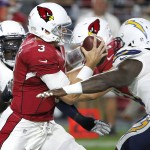 Arizona Cardinals quarterback Carson Palmer (3) is sacked by San Diego Chargers outside linebacker Melvin Ingram (54) during the first half of an NFL preseason football game, Saturday, Aug. 22, 2015, in Glendale, Ariz. (AP Photo/Ross D. Franklin)