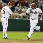 Arizona Diamondbacks' Welington Castillo, right, is congratulated by third base coach Andy Green after hitting a solo home run against the Philadelphia Phillies during the fifth inning of a baseball game, Monday, Aug. 10, 2015, in Phoenix. (AP Photo/Ralph Freso)