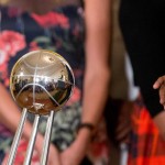 President Barack Obama is reflected in the WNBA championship trophy, as he speaks in the East Room of the White House in Washington, Wednesday, Aug. 26, 2015, during a ceremony honoring the 2014 WNBA basketball Champions Phoenix Mercury. (AP Photo/Andrew Harnik)