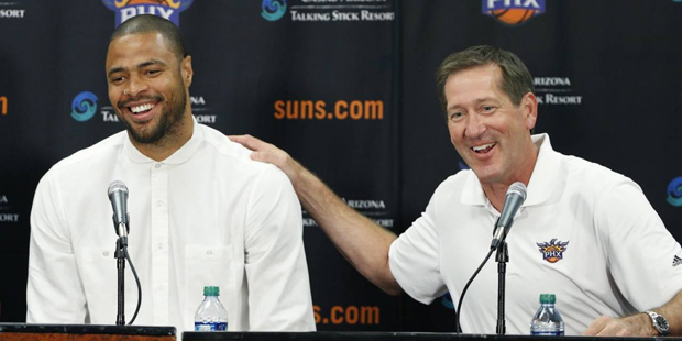 Phoenix Suns’ Tyson Chandler, left, the newly signed free agent, laughs along with head coach...