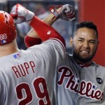 Philadelphia Phillies' Cameron Rupp (29) celebrates his three-run home run against the Arizona Diamondbacks with Andres Blanco during the sixth inning of a baseball game Wednesday, Aug. 12, 2015, in Phoenix. (AP Photo/Ross D. Franklin)