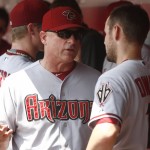 Arizona Diamondbacks manager Chip Hale, left, talks with second baseman Chris Owings, right, in the first inning of a baseball game with the Cincinnati Reds, Sunday, Aug. 23, 2015, in Cincinnati. (AP Photo/David Kohl)