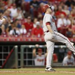 Arizona Diamondbacks' Aaron Hill, right, reacts after striking out against Cincinnati Reds starting pitcher John Lamb during the fourth inning of a baseball game, Thursday, Aug. 20, 2015, in Cincinnati. (AP Photo/Gary Landers)