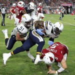 San Diego Chargers inside linebacker Kavell Conner (53) is tackled by Arizona Cardinals quarterback Drew Stanton (5) after an interception during the first half of an NFL preseason football game, Saturday, Aug. 22, 2015, in Glendale, Ariz. (AP Photo/Ross D. Franklin)