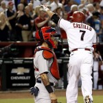 Arizona Diamondbacks' Welington Castillo (7) points to the crowd after hitting a home run as St. Louis Cardinals' Yadier Molina, left, watches during the second inning of a baseball game Monday, Aug. 24, 2015, in Phoenix. (AP Photo/Ross D. Franklin)