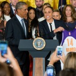 Former Phoenix Mercury basketball guard Diana Taurasi presents President Barack Obama with a XL jersey in the East Room of the White House in Washington, Wednesday, Aug. 26, 2015, during a ceremony honoring the 2014 WNBA basketball Champions Phoenix Mercury. (AP Photo/Andrew Harnik)