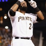 Pittsburgh Pirates' Pedro Alvarez points skyward as he touches home plate after hitting a solo home run in the fifth inning of a baseball game against the Arizona Diamondbacks, Monday, Aug. 17, 2015, in Pittsburgh. (AP Photo/Keith Srakocic)