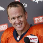 Denver Broncos quarterback Peyton Manning jokes with reporters after an NFL football scrimmage at the Broncos' headquarters Wednesday, Aug. 26, 2015, in Englewood, Colo. (AP Photo/David Zalubowski)